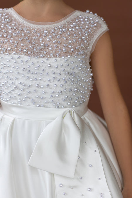 Close up of pearl embellished bodice on white flower girl dress, luxury flower girl gown Australia.