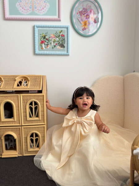 Girl in champagne bow flower girl dress Australia, elegant flower girl gown with tulle skirt.