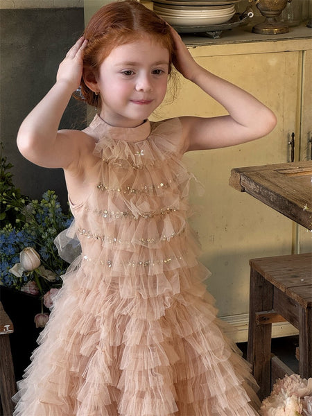 Girl in champagne gold tutu flower girl dress with pearls, elegant layered flower girl gown Australia.