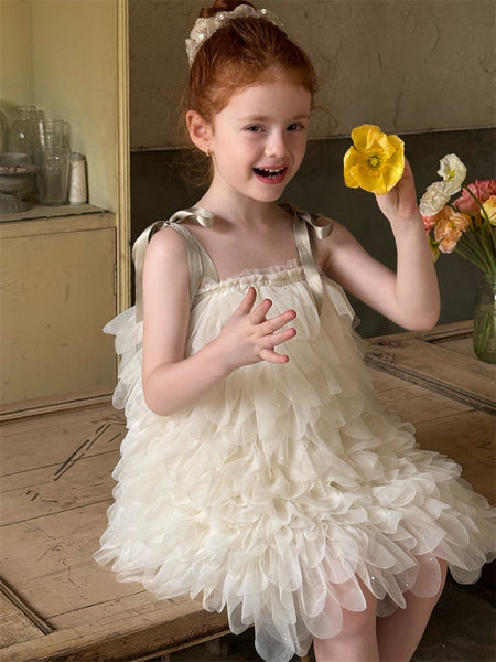 Girl in couture white feathered tutu flower girl dress Australia, elegant short flower girl outfit for parties and weddings.