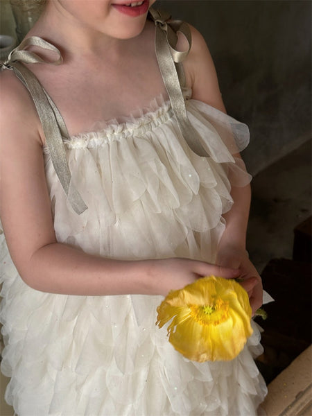 Close up of feather textured white tutu flower girl dress with straps, luxury flower girl gown Australia.