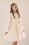 Girl modelling an ivory white long sleeve formal dress for special occasions