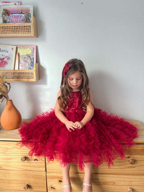 Girl in red tutu dress with fluffy skirt, toddler party and Christmas outfit.
