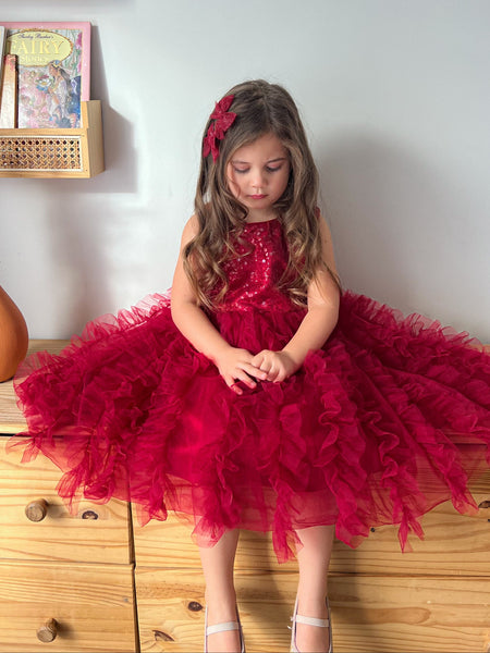 Girl wearing Eva red sequin Christmas tutu dress