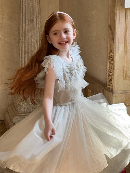 Girl twirling in Clara Grey Sequin Tulle Dress indoors
