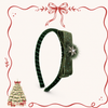 Side view of burgundy velvet bow Christmas headband with festive jewelled detail