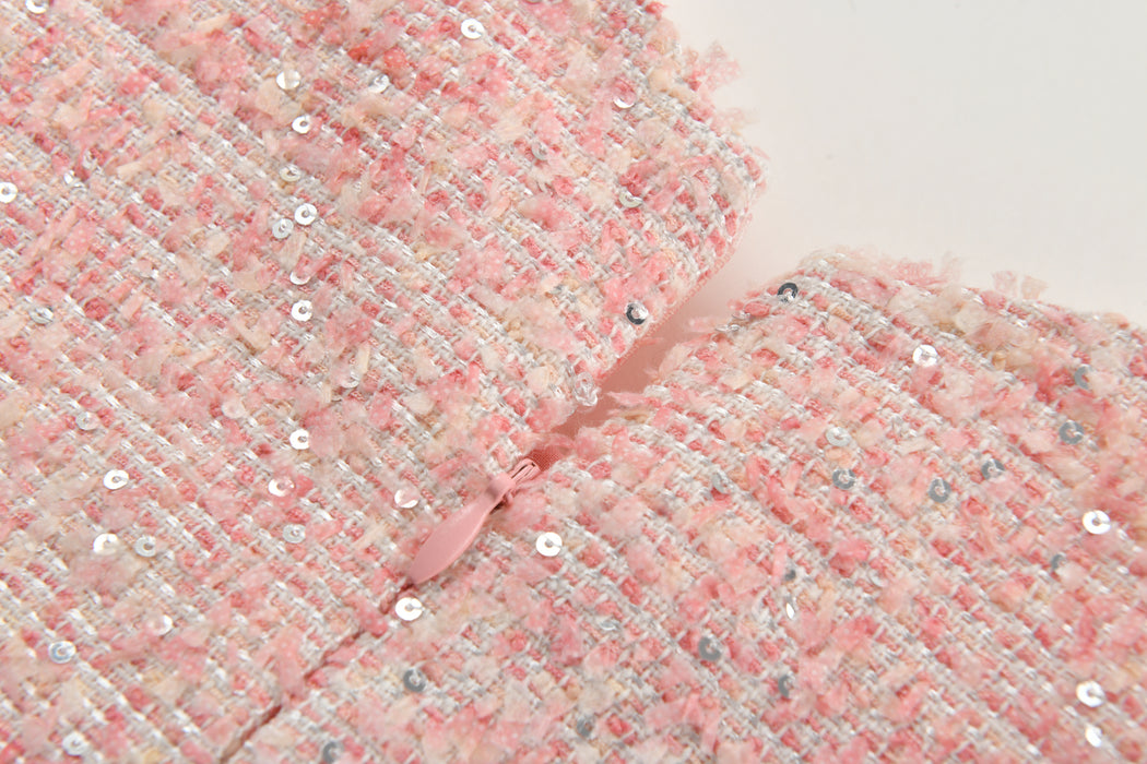 close-up of pink tweed texture with shimmer detail for girls dress