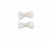 White bow hair clips for girls on a white background
