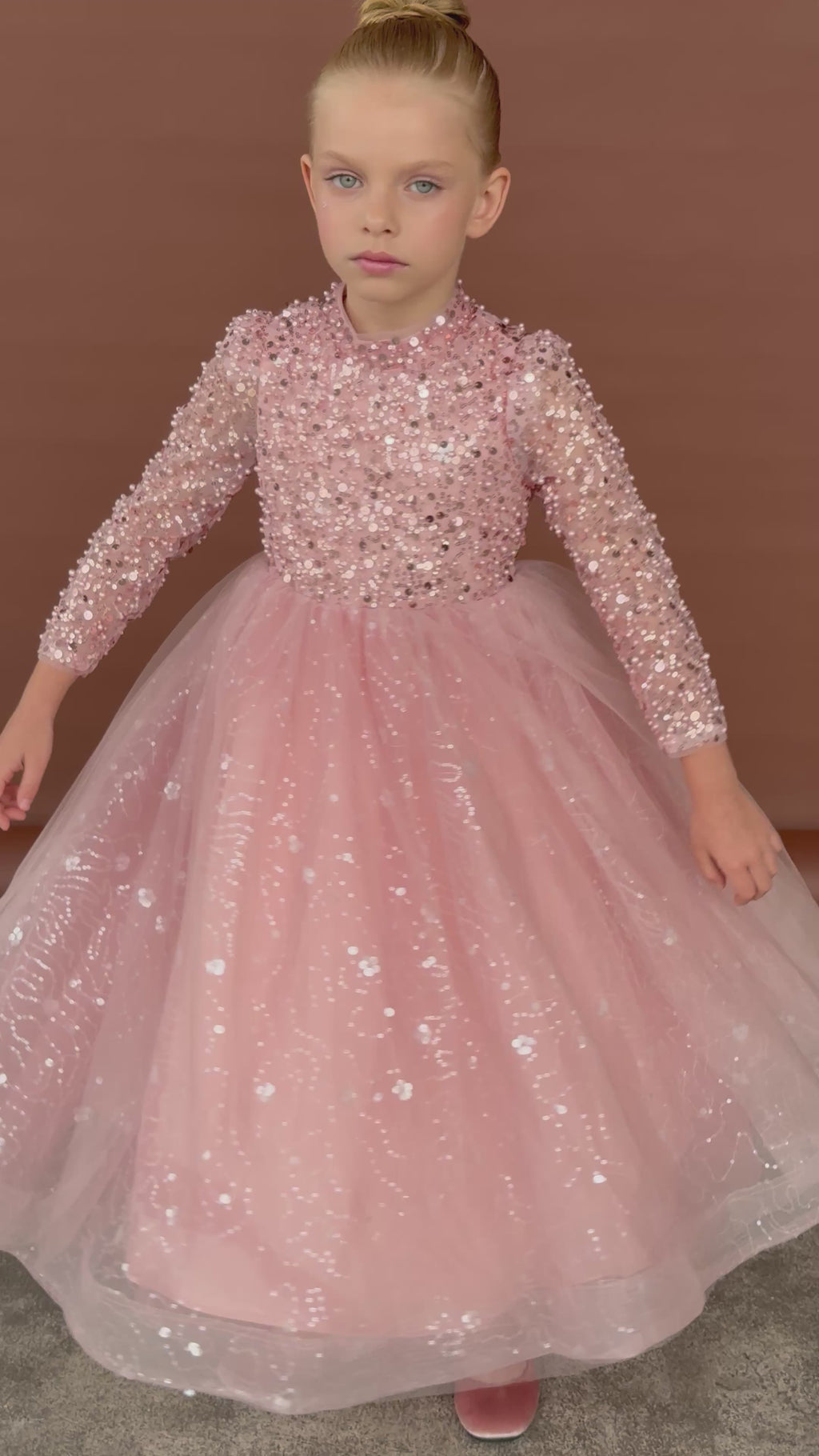 girls twirling in Elegant pink tulle dress with pearl, sequin, and glitter detail