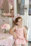 birthday girl in elegant pink tweed dress with sparkle details